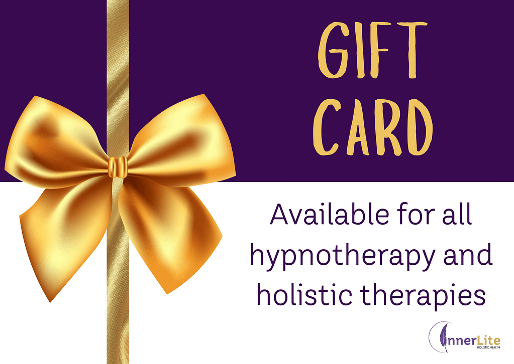 A visually striking promotional gift card graphic for InnerLite Holistic Health. The design features a rich purple and white background divided horizontally, with a luxurious golden ribbon and bow vertically aligned to the left. In the top right, bold golden text reads “GIFT CARD.” Below, the message “Available for all hypnotherapy and holistic therapies” is written in elegant purple text. The InnerLite logo appears in the bottom right corner.